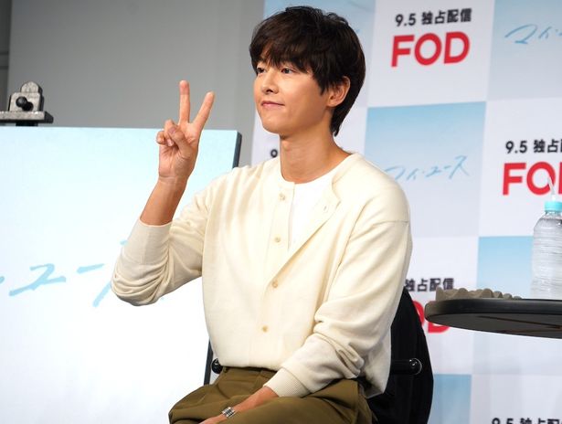 カメラに向かってニッコリ